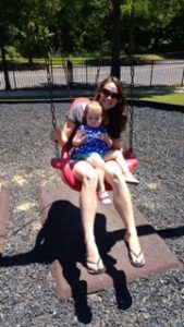 Swinging with Delise at a park.